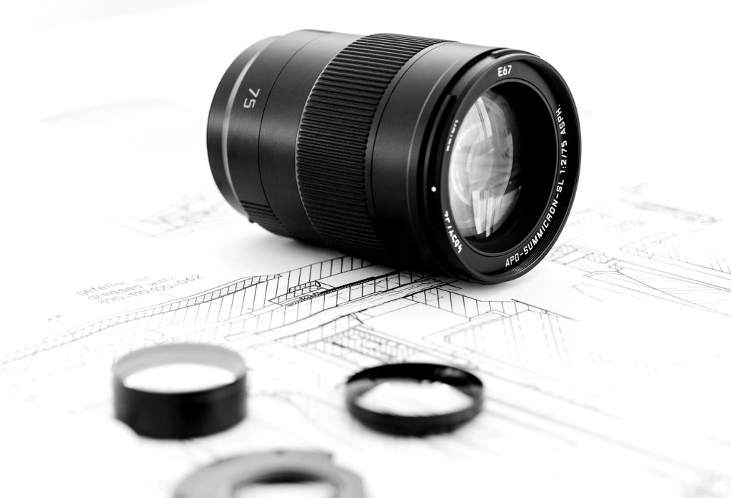 camera lens sample parts on artwork made by precision cnc machining